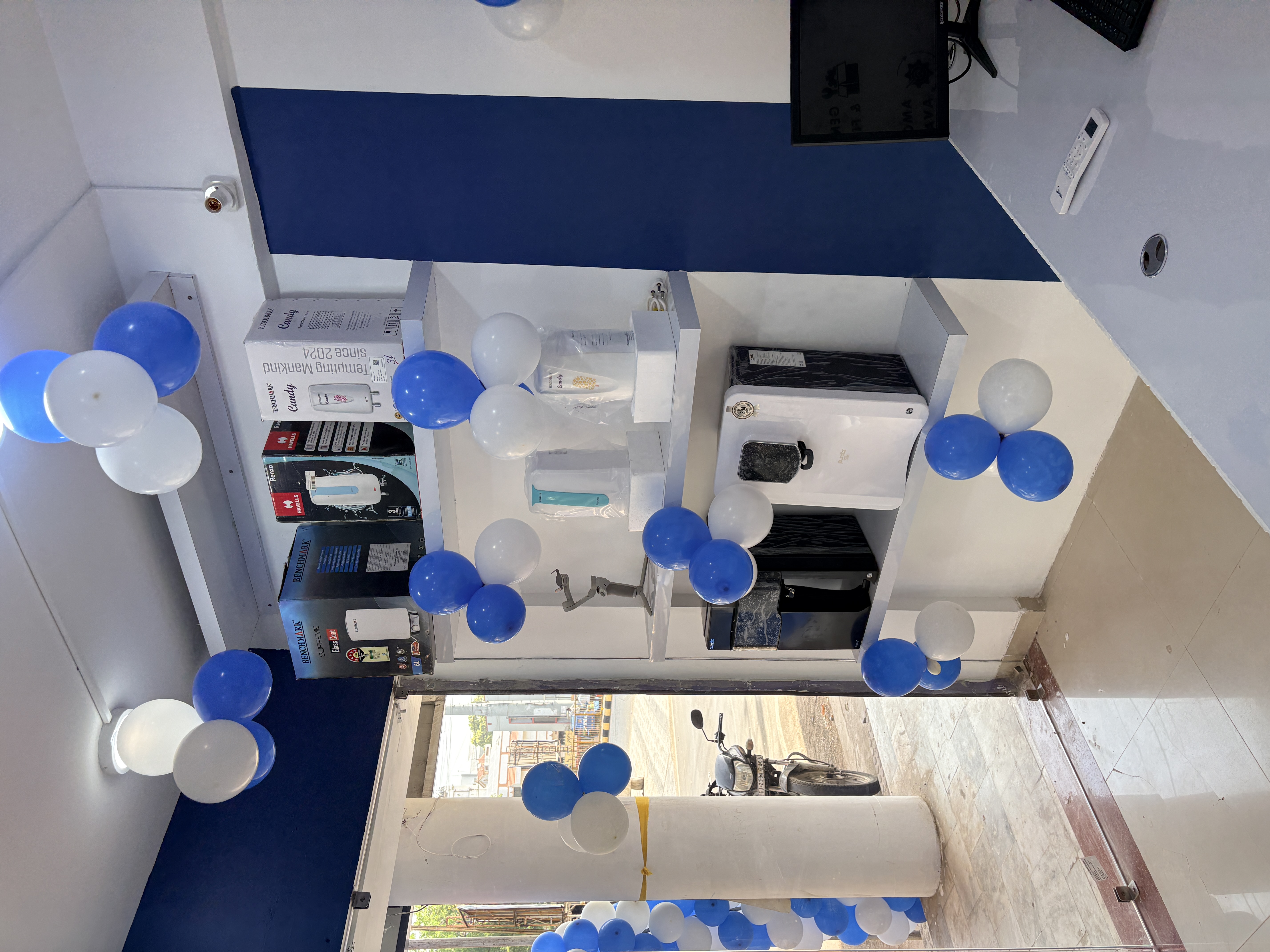 Mr. H2O showroom shelving displaying RO purifiers and water heaters from Benchmark and Havells Renzo