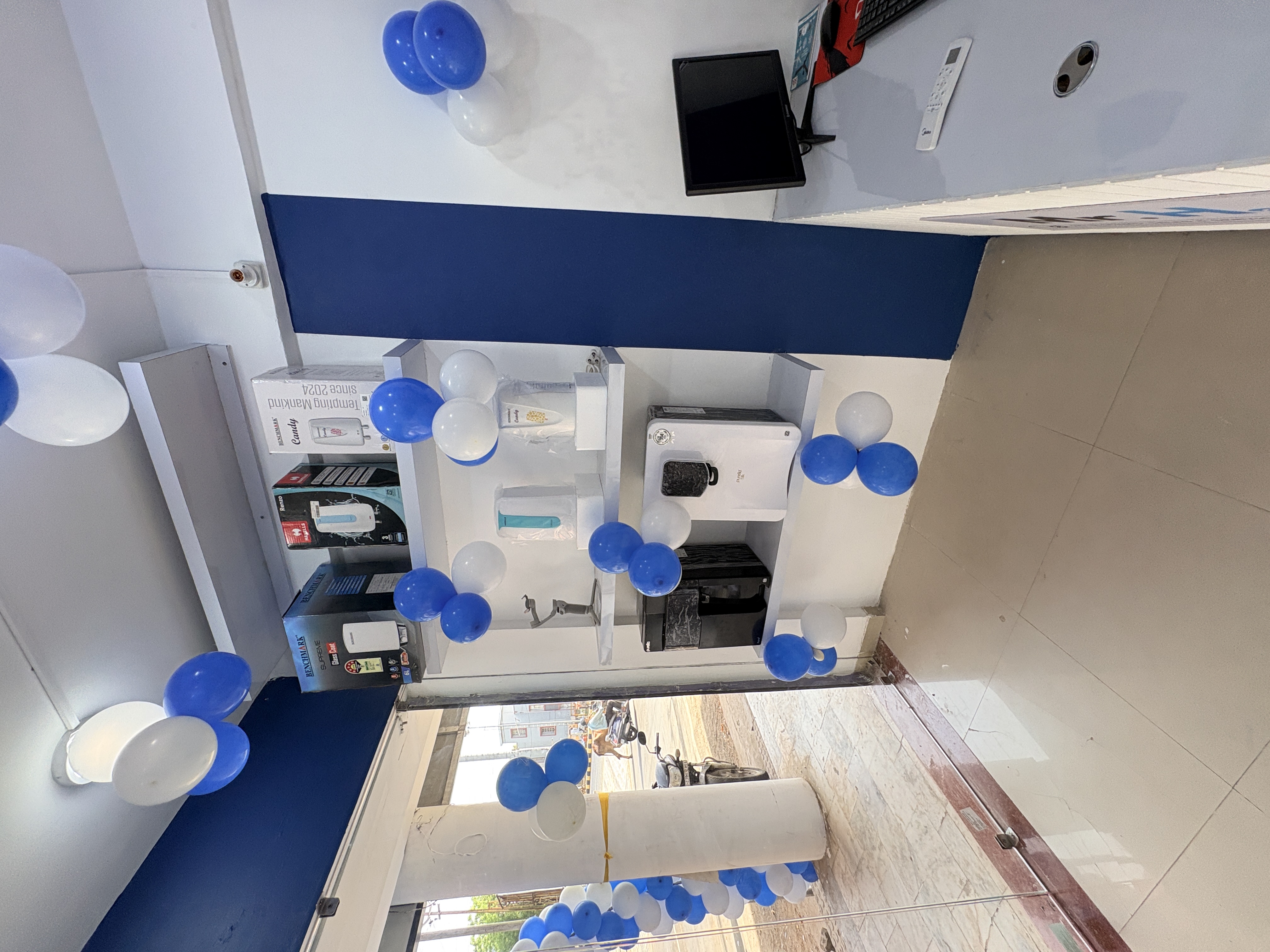 Wide interior view of Mr. H2O showroom product display and reception area at franchise store opening