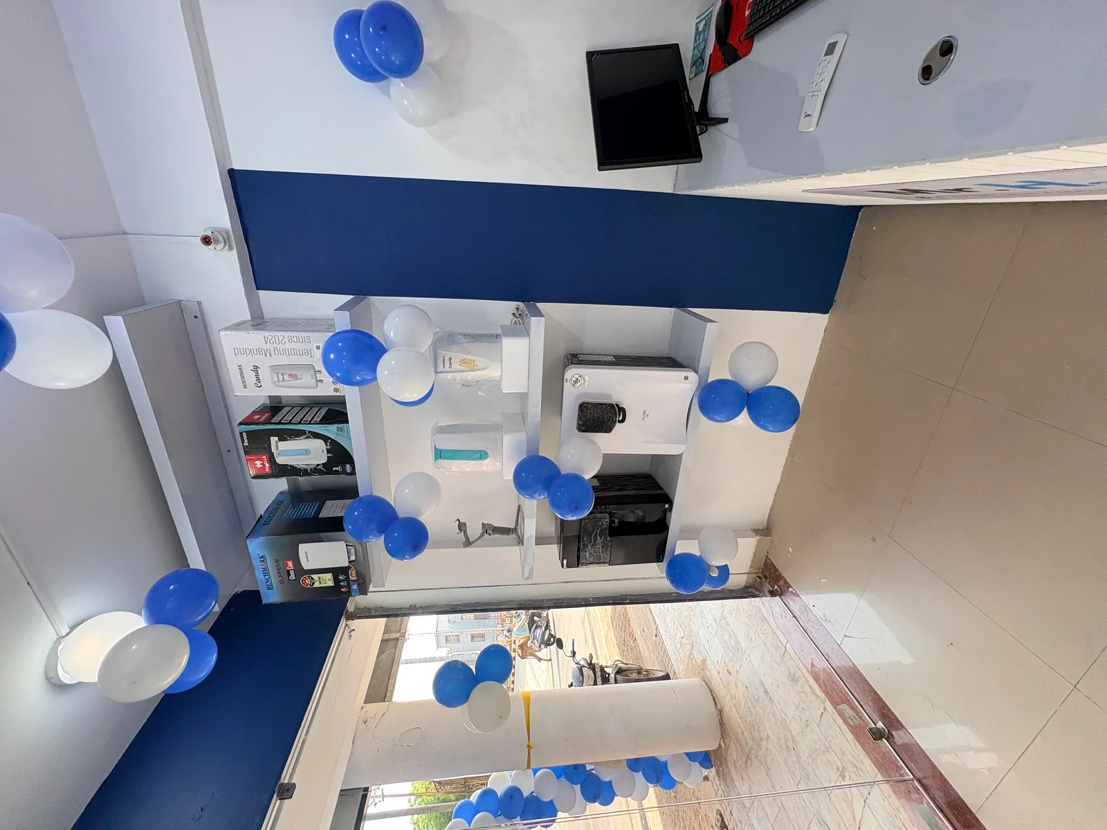 Wide interior view of Mr. H2O showroom product display and reception area at franchise store opening