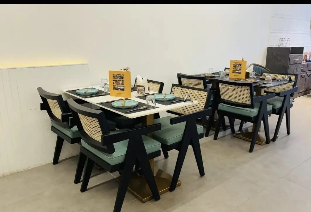 Thai Asian Food Restaurant, Ahmedabad — table setting for four with menu cards