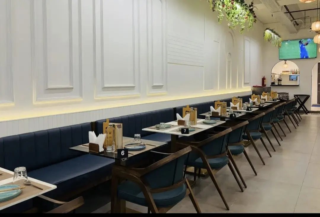 Thai Asian Food Restaurant, Ahmedabad — dining hall with booth seating along the wall, ready for service