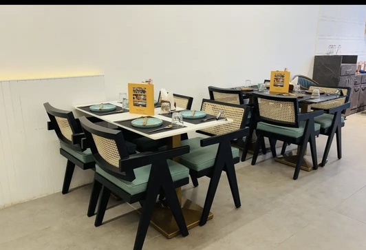 Thai Asian Food Restaurant, Ahmedabad — table setting with menu card and glassware